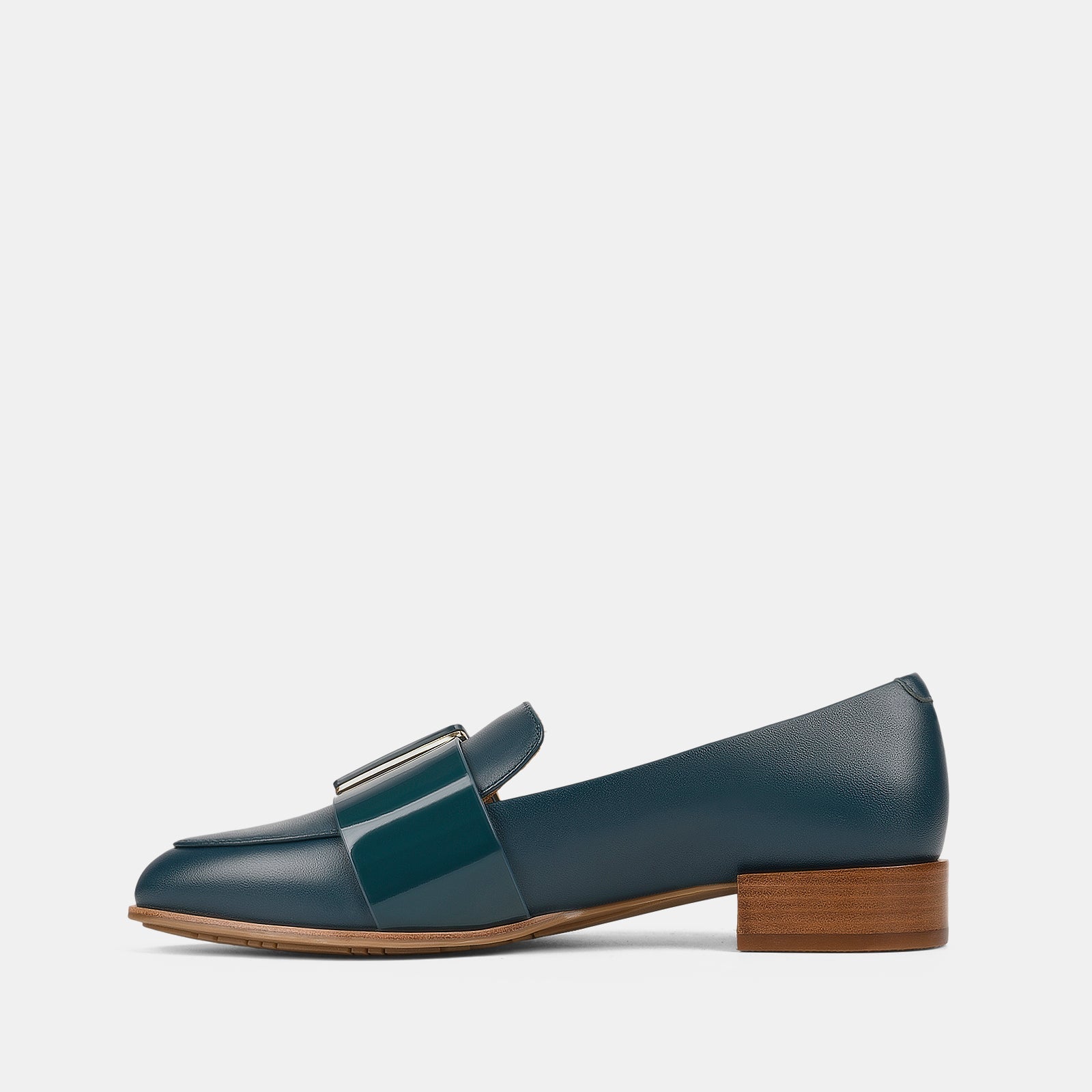 Navy blue loafer shoe with a wooden sole on a white background