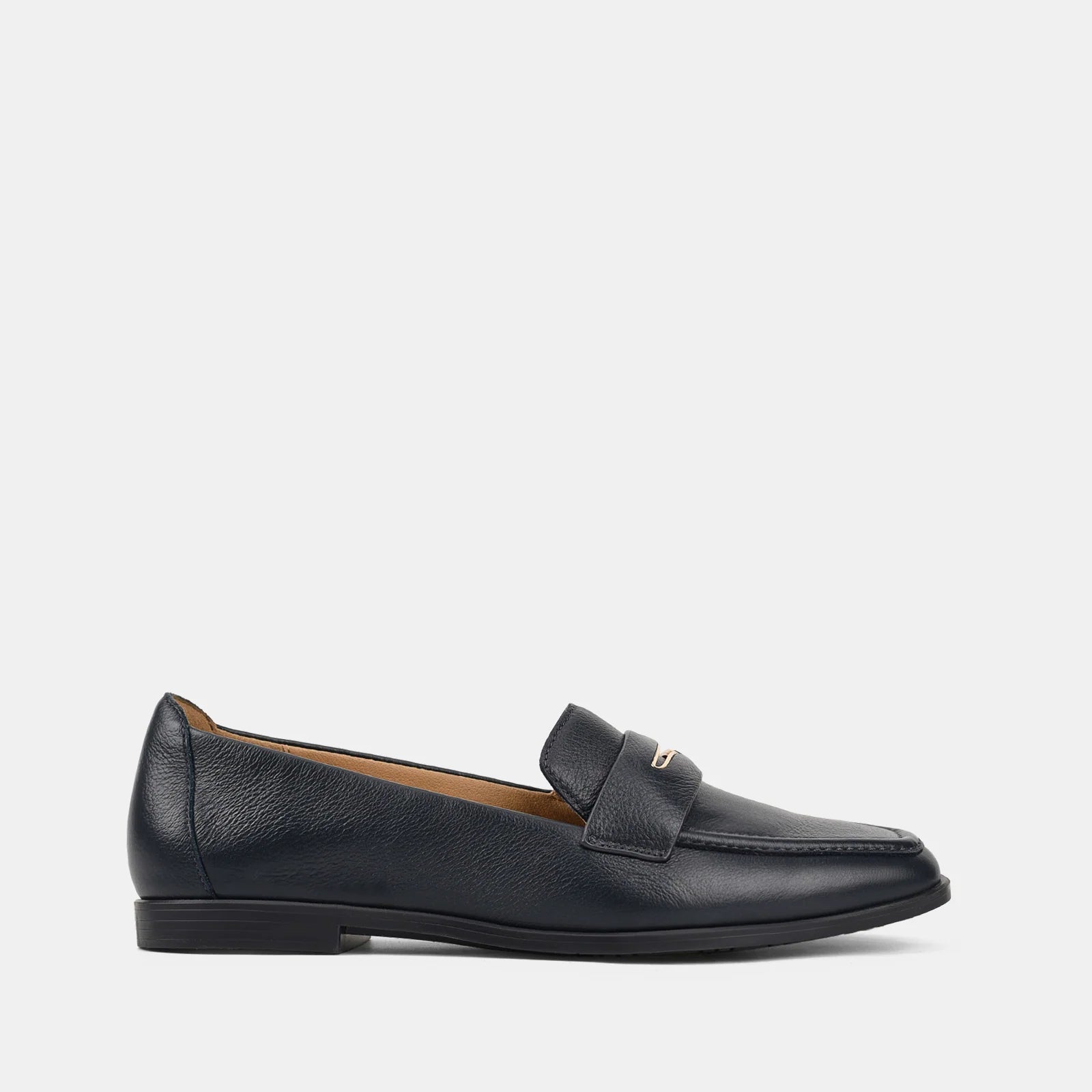 Black loafer shoe on a light gray background