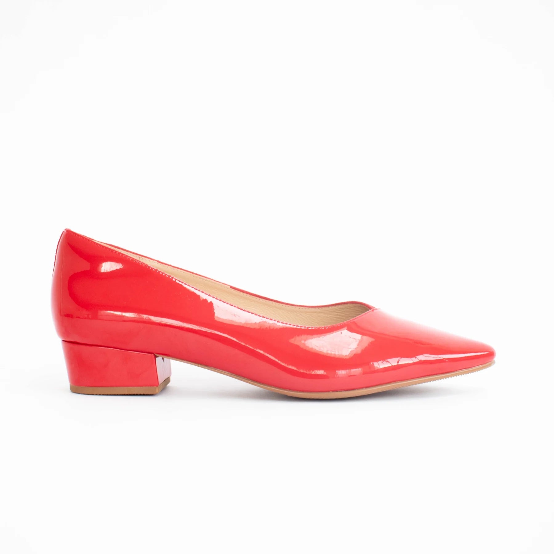 Shiny red high heel shoe on a white background