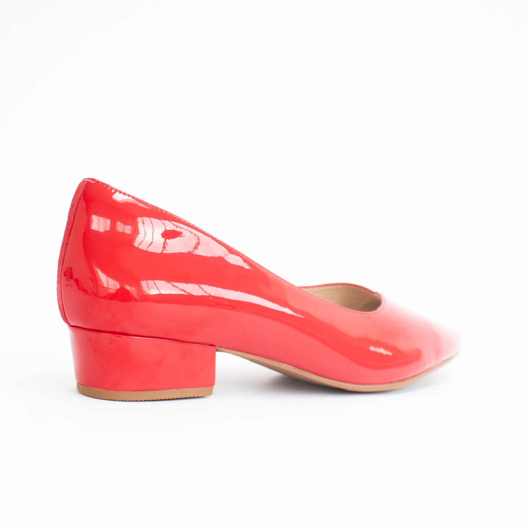 Shiny red shoe on a white background