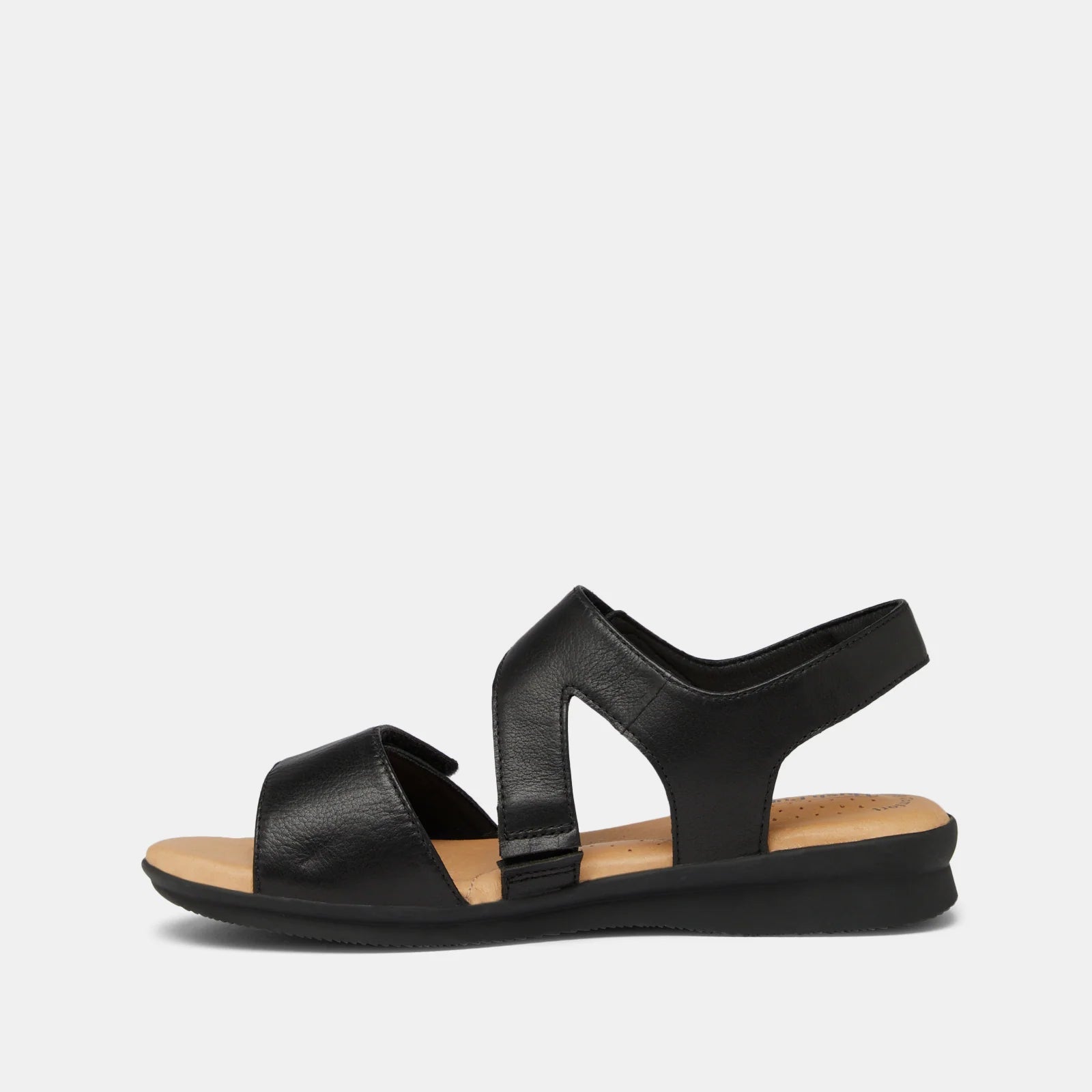 A single black leather flat sandal with cutout straps and a tan footbed, shown in a side profile against a light gray background.