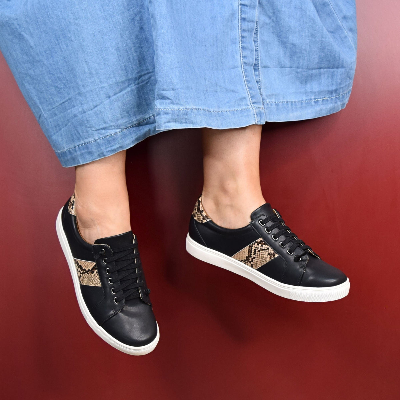 Skale Black Snake by Step on Air | Womens sneakers by red back drop 