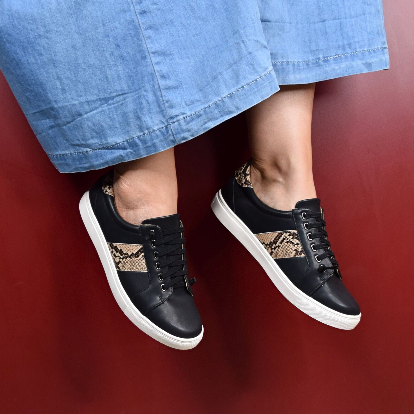 Skale Black Snake by Step on Air | Womens sneakers by red back drop 