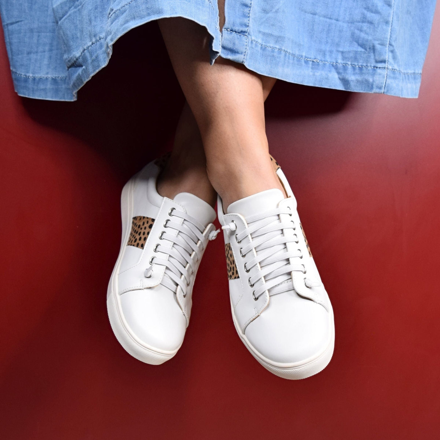 Skale White Leopard by Step on Air | Womens sneakers by red backdrop 