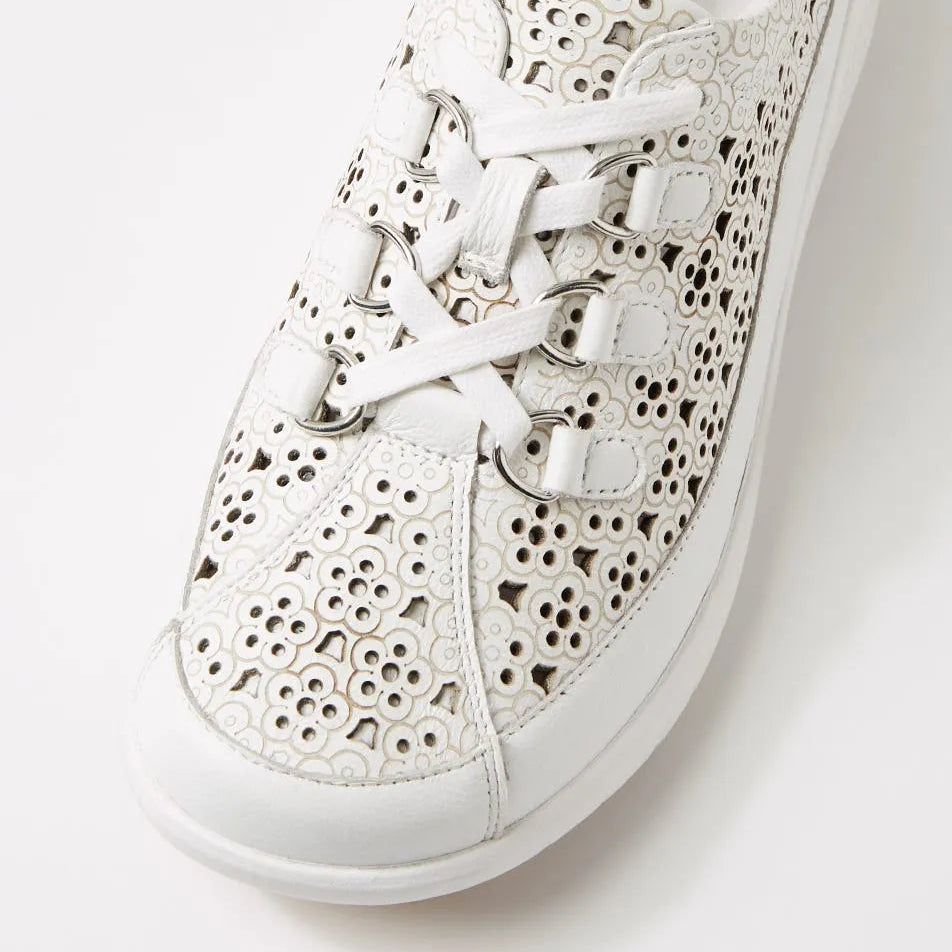 White lace-up sneaker with cut-out design on a white background