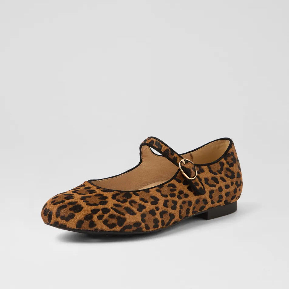 Leopard print flat shoe with a strap on a light gray background