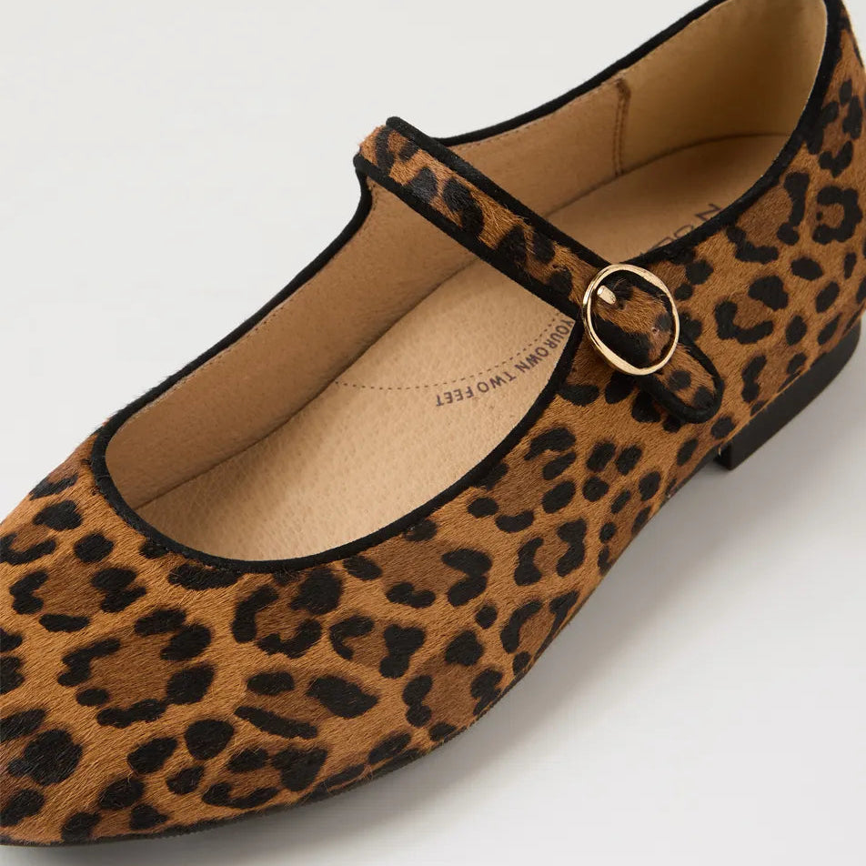 Leopard print flat shoe with a gold buckle on a light gray background
