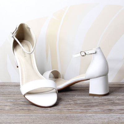 Adoor White by Clarice | Womens Heels by floral back drop 